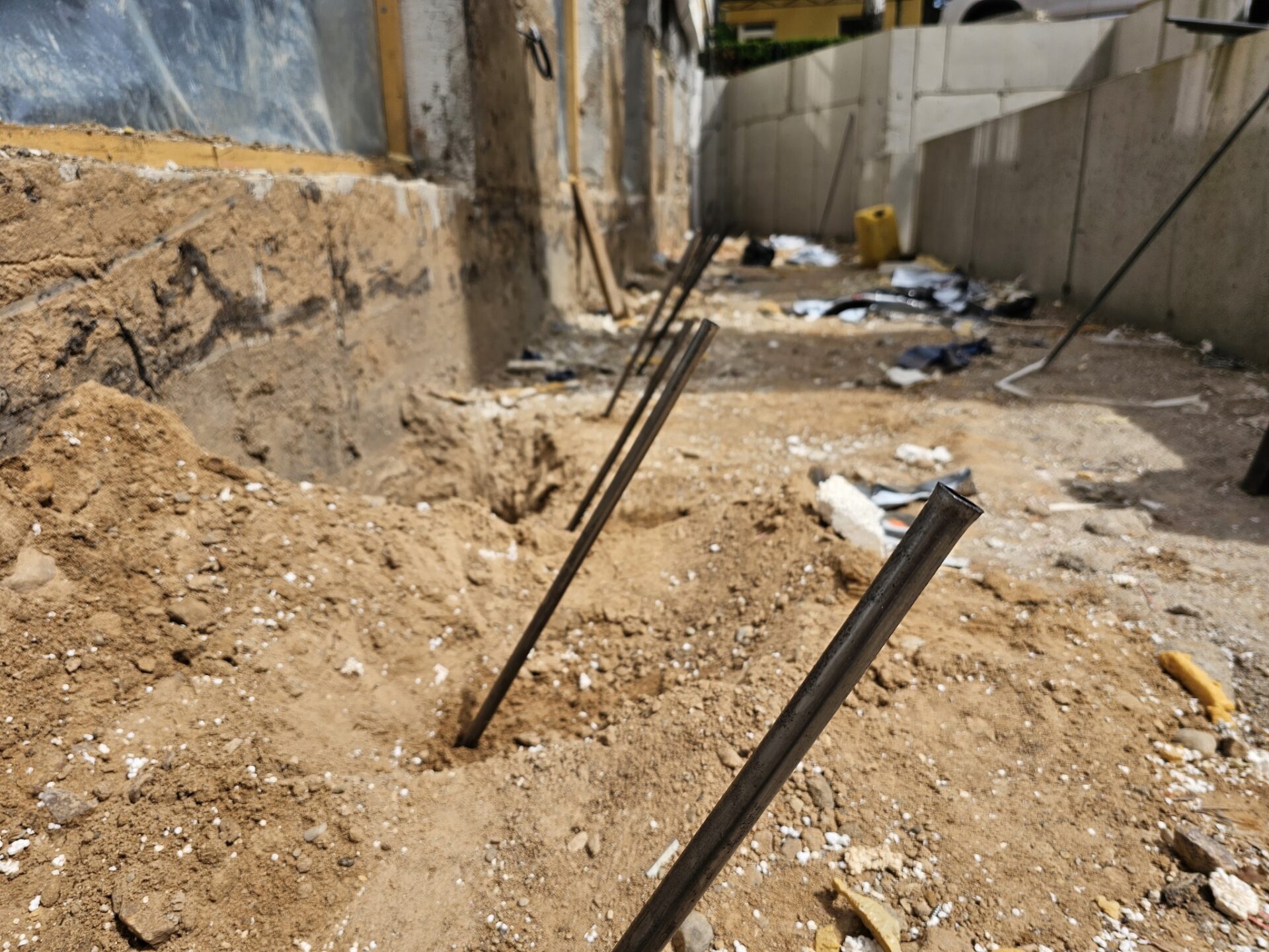 Geopolymer injection tubes installed for floor and foundation stabilization
